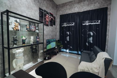 a living room with a couch and a tv at Mount Austin Manhanttan Sovo by Cactus Homestay in Johor Bahru