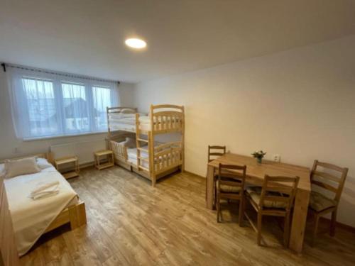 Postel nebo postele na pokoji v ubytování Apartmán Strážný-Šumava