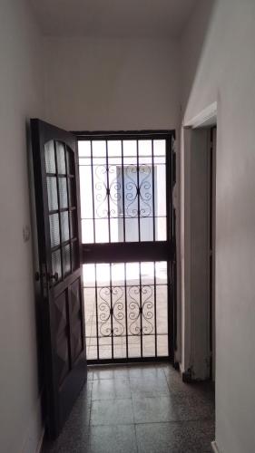 an open door with a gate in a room at Orense in La Rioja