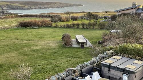 an aerial view of a park with a bench in a field at Tan Y Cytiau in Holyhead