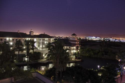 a view of the city at night at Knightsbridge Luxury Apartments in Cape Town
