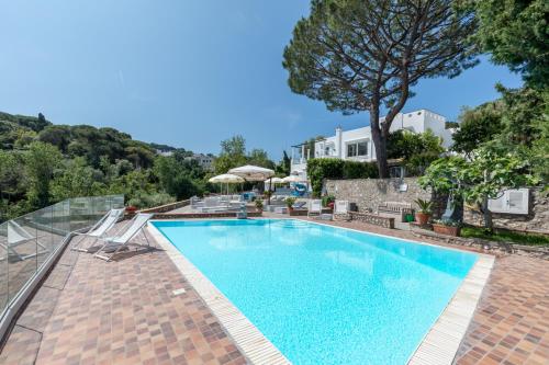 a swimming pool in a villa with a view at Suite Villa Carolina in Capri
