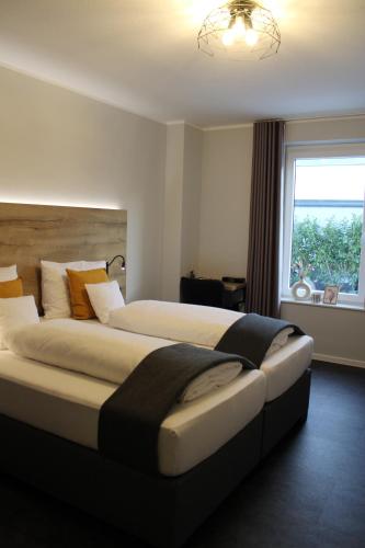 Postel nebo postele na pokoji v ubytování Motel Hasetal