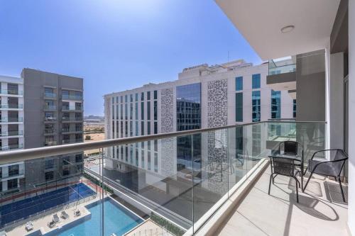 a balcony with a view of a building at Brand New Listing & Studio City & Czechin in Dubai