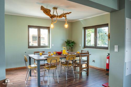 a dining room with a table and chairs at Palmeiras Beach House - Santa Cruz in Santa Cruz
