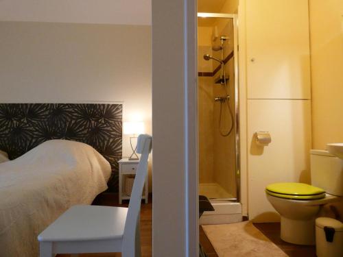 a bedroom with a bed and a shower and a toilet at Appartement spacieux avec rooftop et garages privés à 3 min de la gare d'Épernon - FR-1-581-129 in Épernon