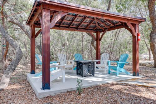 a wooden gazebo with chairs and a table at Lakewood Secret Cabin about 4 Mi to The Lake! in Canyon Lake