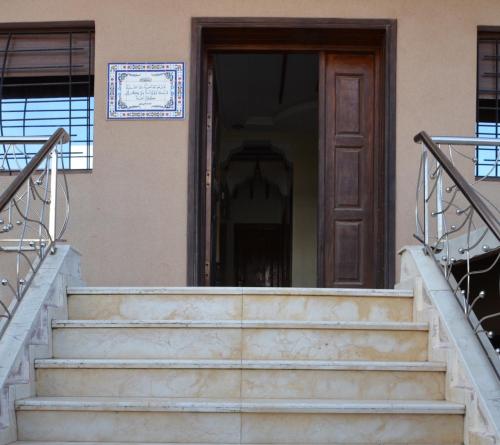 a set of stairs in front of a door at Elegant villa for family and business trips in El Jadida