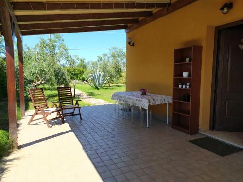 a patio with a table and chairs on a house at A casa di Lucy in Rimini
