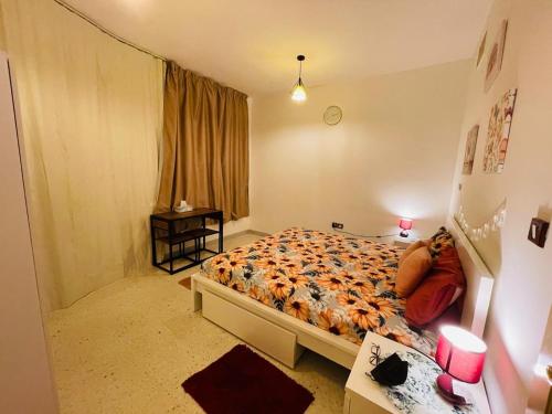 a bedroom with a bed and a desk and a window at A103 Cozy Private Room Shared Apartment Muroor Abu Dhabi UAE in Abu Dhabi