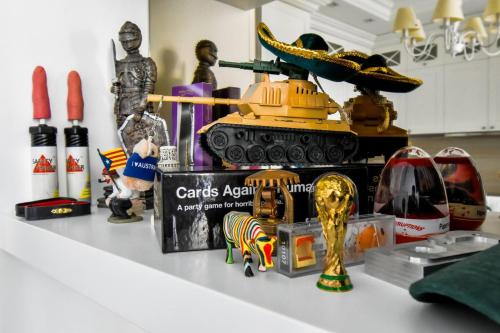 a counter with figurines and a trophy on it at Top 10 3br2bh Jacuzzi Free Parking in Sofia