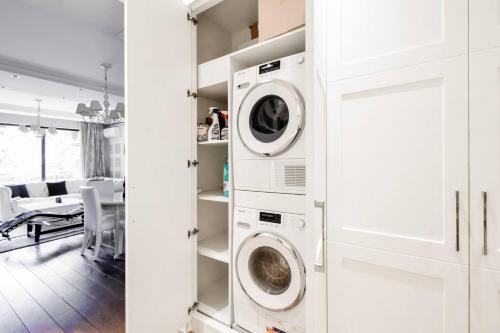 a laundry room with two washer and dryer at Top 10 3br2bh Jacuzzi Free Parking in Sofia