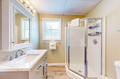 a bathroom with a shower and a sink at The Crossroads at Jay in Jay