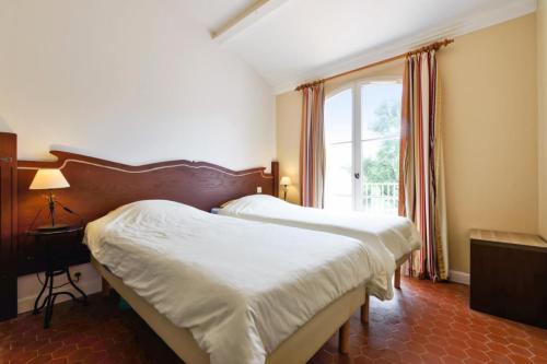 Postel nebo postele na pokoji v ubytování Les Villas aux Restanques du Golfe de St Tropez - maeva Home - Villa spacieus 85