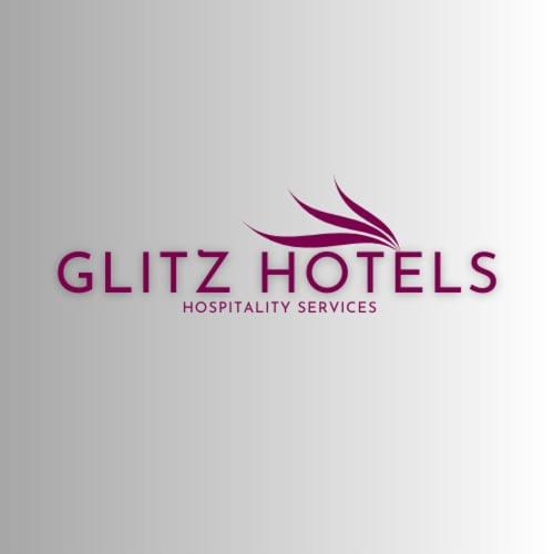 a logo for a hotel with the words slipz hotels at New Bramharaj By Glitz Hotels in Navi Mumbai