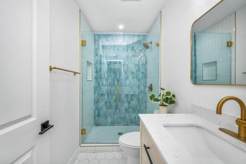a bathroom with a shower and a toilet and a sink at 130 Anderson St B in Sunset Beach