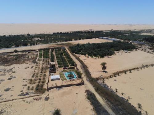 an aerial view of a resort in the desert at La Siwa in Siwa
