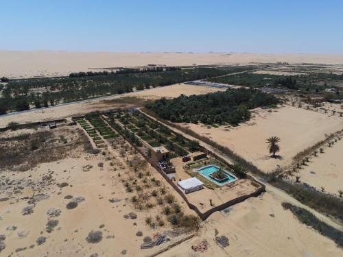 an aerial view of a resort in the desert at La Siwa in Siwa
