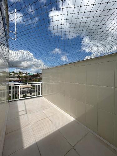a room with a ceiling with a view of a building at Apartamento 246 in Rio Negrinho