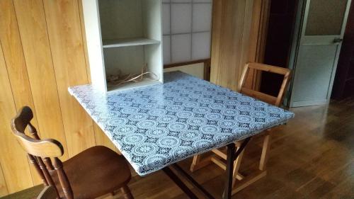 a table with a blue and white table cloth on it at J's Select & Lodge - Vacation STAY 16052 in Kumano