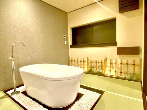 a bathroom with a white toilet in a room at Geku-mae Bettei Hoshiori - Vacation STAY 65143v in Ise