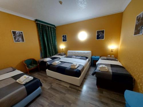 Postel nebo postele na pokoji v ubytování Hotel Positano 2