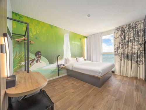 Postel nebo postele na pokoji v ubytování B&B HOTEL Fort-de-France