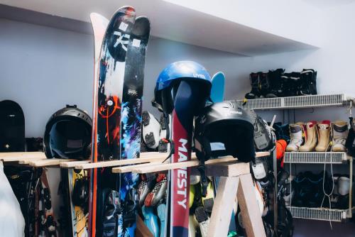 a bunch of skis and snowboards in a room at Маріна Драгобрат in Dragobrat