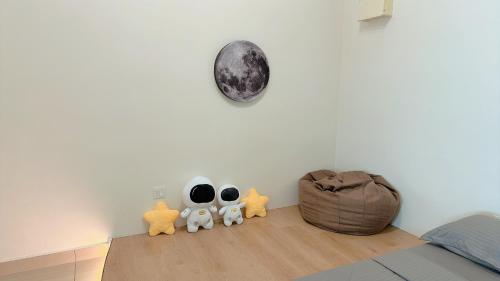 a bedroom with three stuffed animals on the floor at Mount Austin Manhanttan Sovo by Cactus Homestay in Johor Bahru