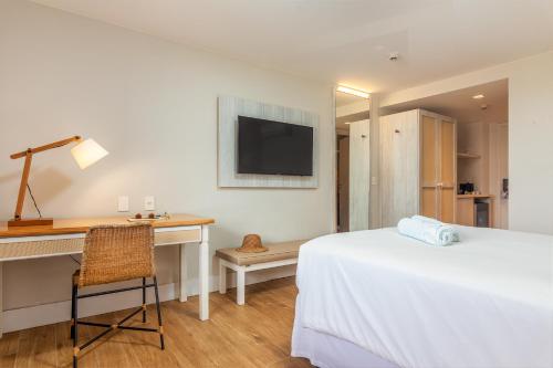 Postel nebo postele na pokoji v ubytování Hotel Aretê