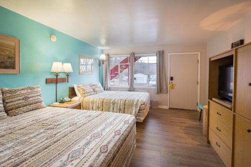 Cama ou camas em um quarto em Apache Motel