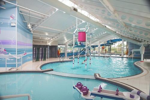 a large swimming pool in a large building at Beautiful Caravan near Edinburgh nr 9 in Port Seton