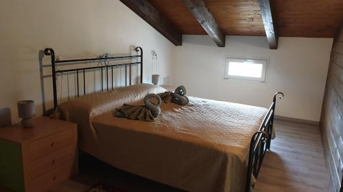 a bedroom with a bed with two bows on it at Bingo in Alghero