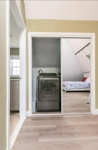 a living room with a tv and a bedroom at LARGE STUDIO open concept in Boston Zoo Franklin Park near in Boston