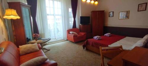 Ruang duduk di Große Wohnung mit Terrasse im Altstadtzentrum - Ferienwohnung Chiplakoff