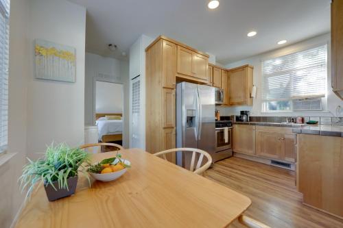 a kitchen with a wooden table with a bowl of fruit on it at Charming Oak View Retreat about 5 Mi to Ojai Valley! in Oak View