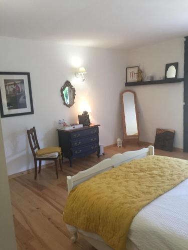 Ein Bett oder Betten in einem Zimmer der Unterkunft Auberge des Pensées