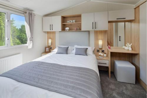 Ένα ή περισσότερα κρεβάτια σε δωμάτιο στο Solway Holiday Park