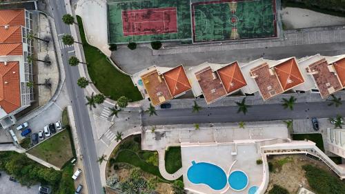 an overhead view of roofs of houses in a city at Ocean Drive in Sesimbra