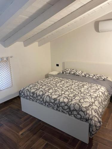 a bedroom with a bed in a room at Casa Borgata in Grondona
