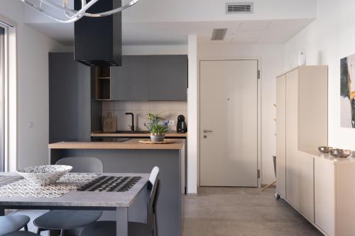 a kitchen with a table and chairs in a room at residence borgo secolo in Peschiera del Garda