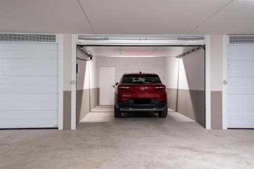 a car is parked inside of a garage at residence borgo secolo in Peschiera del Garda