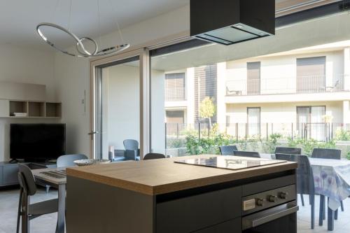 a kitchen and dining room with a table and chairs at residence borgo secolo in Peschiera del Garda