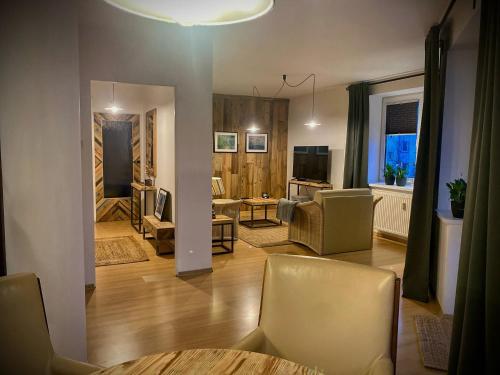 Χώρος καθιστικού στο Mozaika Art Apartment PL LT EN