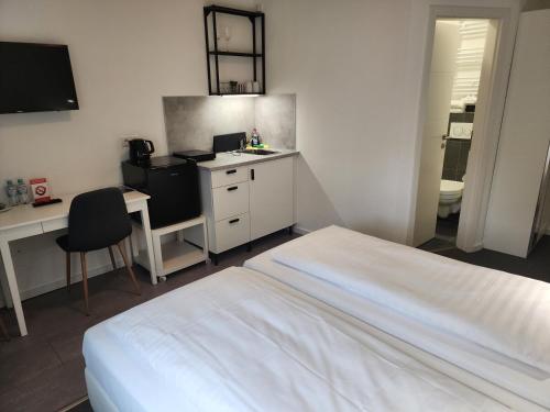 Postel nebo postele na pokoji v ubytování Davin City Aparments - Self-Check-In