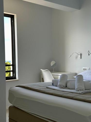 Ένα ή περισσότερα κρεβάτια σε δωμάτιο στο Zen Residence 2