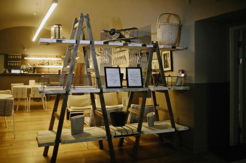 a display of shelves with dishes and baskets on them at Hotel Zenit Budapest Palace in Budapest