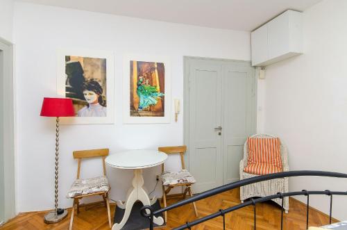 a white room with a table and chairs at Apartment Martini in Split