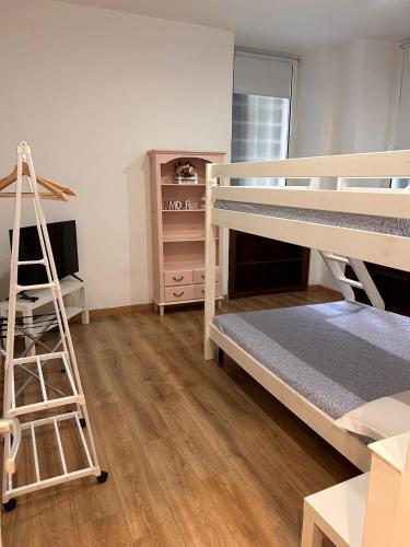 a room with two bunk beds and a ladder at Step by Rome apt in Rome