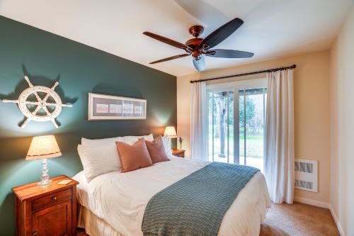 a bedroom with a bed and a ceiling fan at Scenic Carmel Valley Home with Deck Steps to River! in Carmel Valley